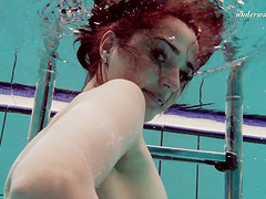 Redhead European babe showcasing nice ass underwater