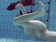 Home video of Russian teen Liza Rachinska swims in the pool naked
