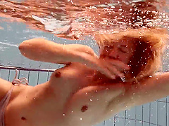 Russian babe Iva Brizgina gets naked and jumps in the swimming pool