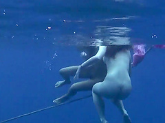 Wild girls swimming naked in the ocean while a friend films them