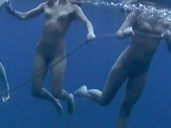 Wild girls swimming naked in the ocean while a friend films them