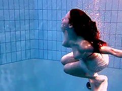 Solo babe Andrea loves to go skinny dipping in the family pool