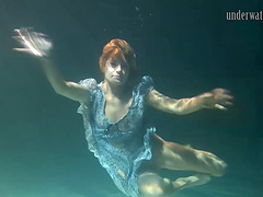 Small tits teen shading attire seductively under water