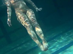 Lenochka Chernova goes swimming naked and plays underwater