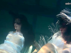 Natural boobs European lesbian swimming with her babe underwater