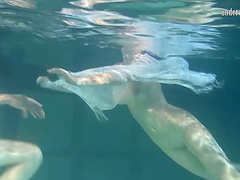 Natural boobs European lesbian swimming with her babe underwater