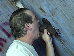 Dirty white male loves to suck a fat black dick thru Gloryhole
