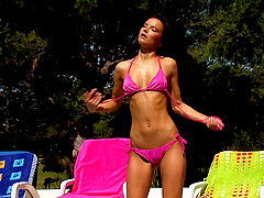 Solo model Klara moans while masturbating by the outdoors pool