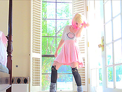 Astrid stripteasing showcasing her shaved pussy in close up