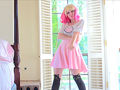 Astrid stripteasing showcasing her shaved pussy in close up