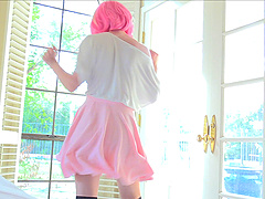 Astrid stripteasing showcasing her shaved pussy in close up