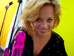 Slutty blonde chick loves to tease with her purple sex toy