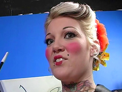 Tattooed Candy Monroe giving dick blowjob in interracial porn