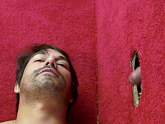 Tattooed gay Brad giving dick blowjob while wanking