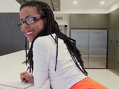 Kira Noir is an ebony babe with glasses ready to be plowed