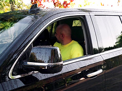 Moriah Mills kneeling outside and sucking a delicious cum gun