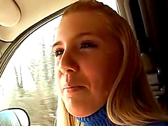 Blondie in a blue pullover gives an incredible handjob in a car