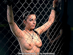 Gorgeous brunette girl gets tied up to the fence by two friends