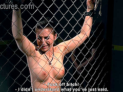 Gorgeous brunette girl gets tied up to the fence by two friends