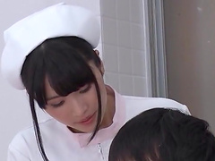 Lovely brunette nurse pleases a patient by sucking his cock