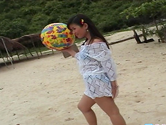 Solo Asian chick Katie Chung likes to pose on the beach