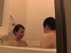 Japanese brunette MILF babe gives a great blowjob in the bathroom