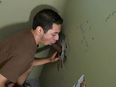 Latino gay dude sucks and plays with a big black glory hole cock