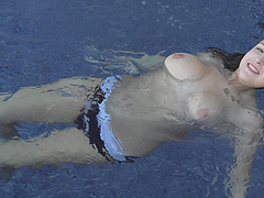 Solo amateur bombshell blonde Sarah takes a naked swim