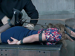 Devilynne tied up on a table and gets her tits and pussy tortured