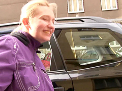 Pale blonde cutie Monika L gives stranger a kinky clothed handjob