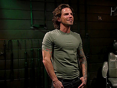 Naked muscular dude tied up and gets his rock hard dick pleasured