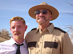 Gay BDSM scene with a handsome man getting fucked by a cop