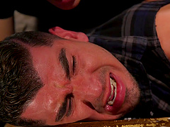 Nasty gay dudes tied up one man to pleasure his stiff cock