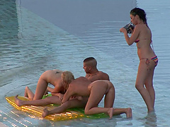 Crazy outdoor threesome by the public pool with two sexy babes