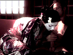 Costumed brunette Mai Bailey gives a blowjob to her boyfriend