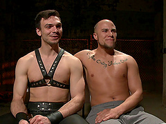 Gay BDSM sex scene with one tied up slave and his dominant partner