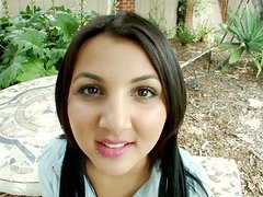 An adorable brunette teen goes down on her knees