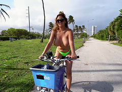 Dirty cougar Jazmyn rides a bike topless and gets fucked good