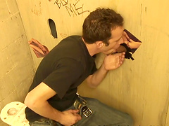 White man strokes his dick while blowing a stranger via gloryhole