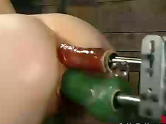 Curly-haired chick Randi gets fucked by a fucking machine in a cellar