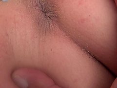 Purple haired Lily Adams gives her boyfriend a blowjob on the beach