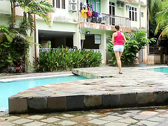 A couple engaged in passionate sex right in the open air in their bikinis