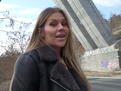 Guy and girl have fun in his car.