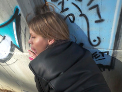 Guy and girl have fun in his car.