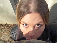 Guy and girl have fun in his car.