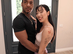 Asian slut Elle Lee pleases a black dude by riding his dick