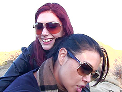 Glasses-wearing lesbian babes enjoy outdoor pussy fucking