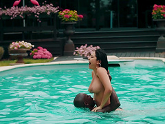 Brunette chick Mariska X riding a black cock by the pool