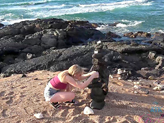 Natural blonde Melody Marks strips down to pose nude on the beach