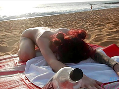 Natural tits bounce as couple fucks on the beach